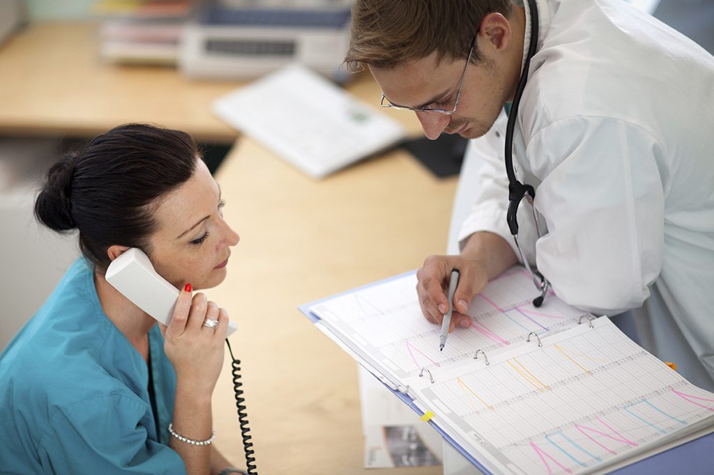 doctor speaking with reception