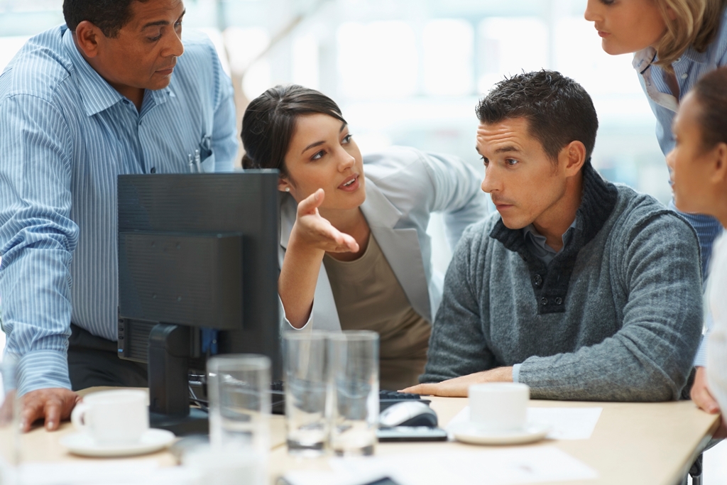 Colleages sitting infront of a computer
